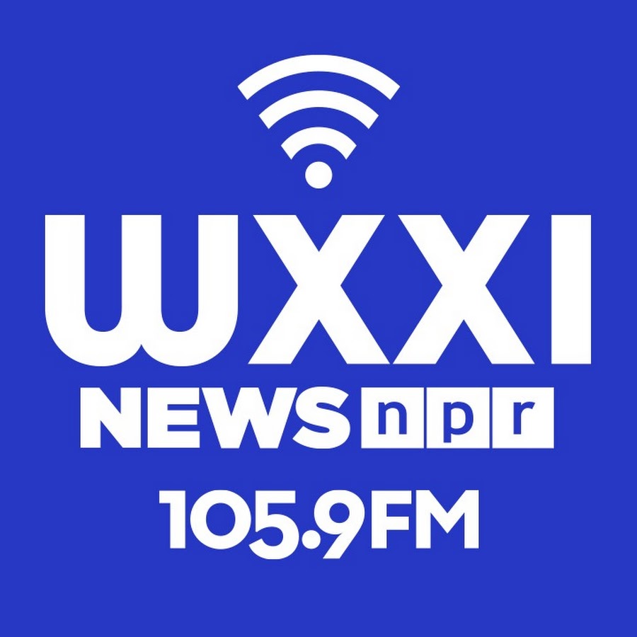 Logo for WXXI News 105.9FM featuring bold white text, the NPR logo, and a wireless signal icon on a bright blue background.